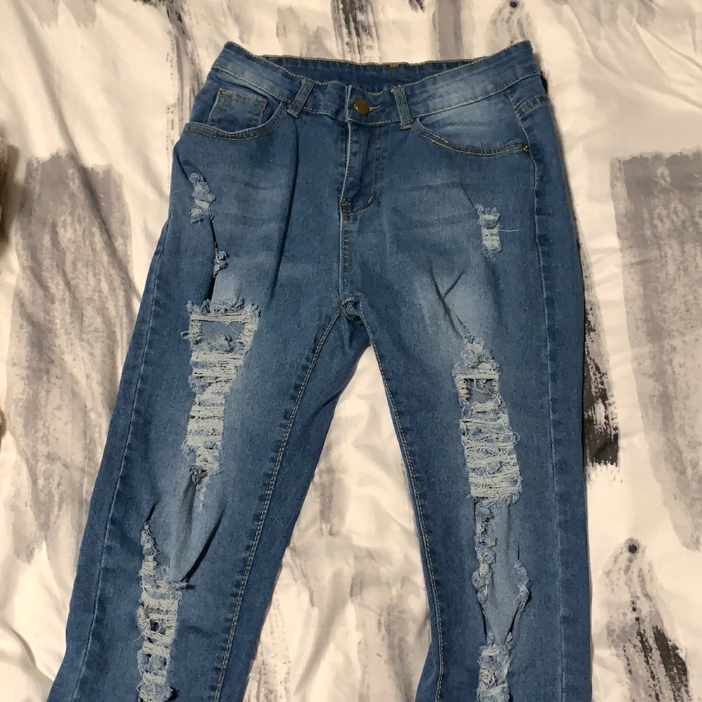 Blue jeans and ripped.